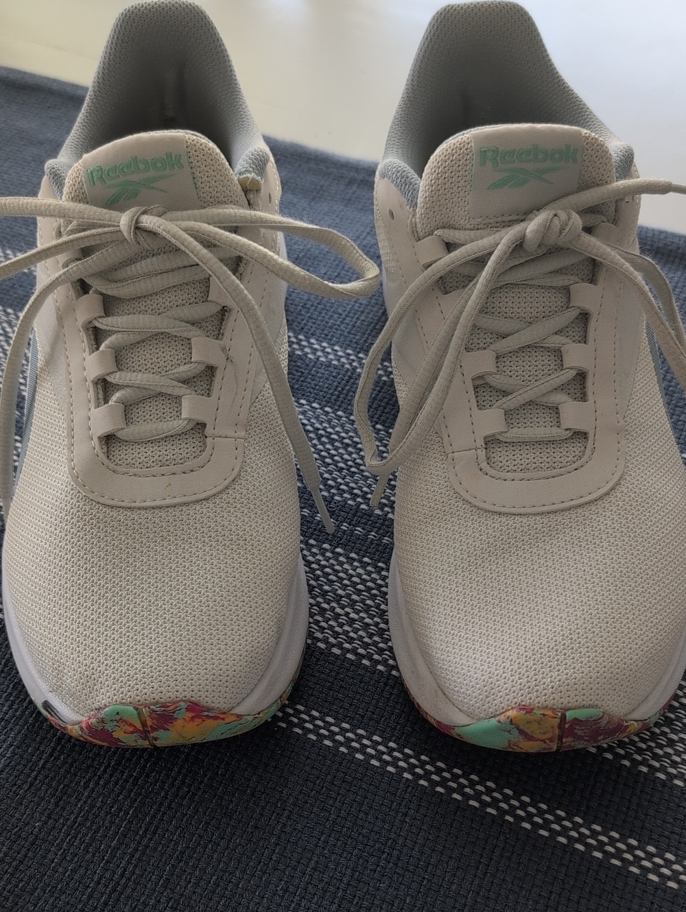 Reebok Women’s Off-White Mesh Sneakers with Mint Logo and Multicolor Floral Toe.